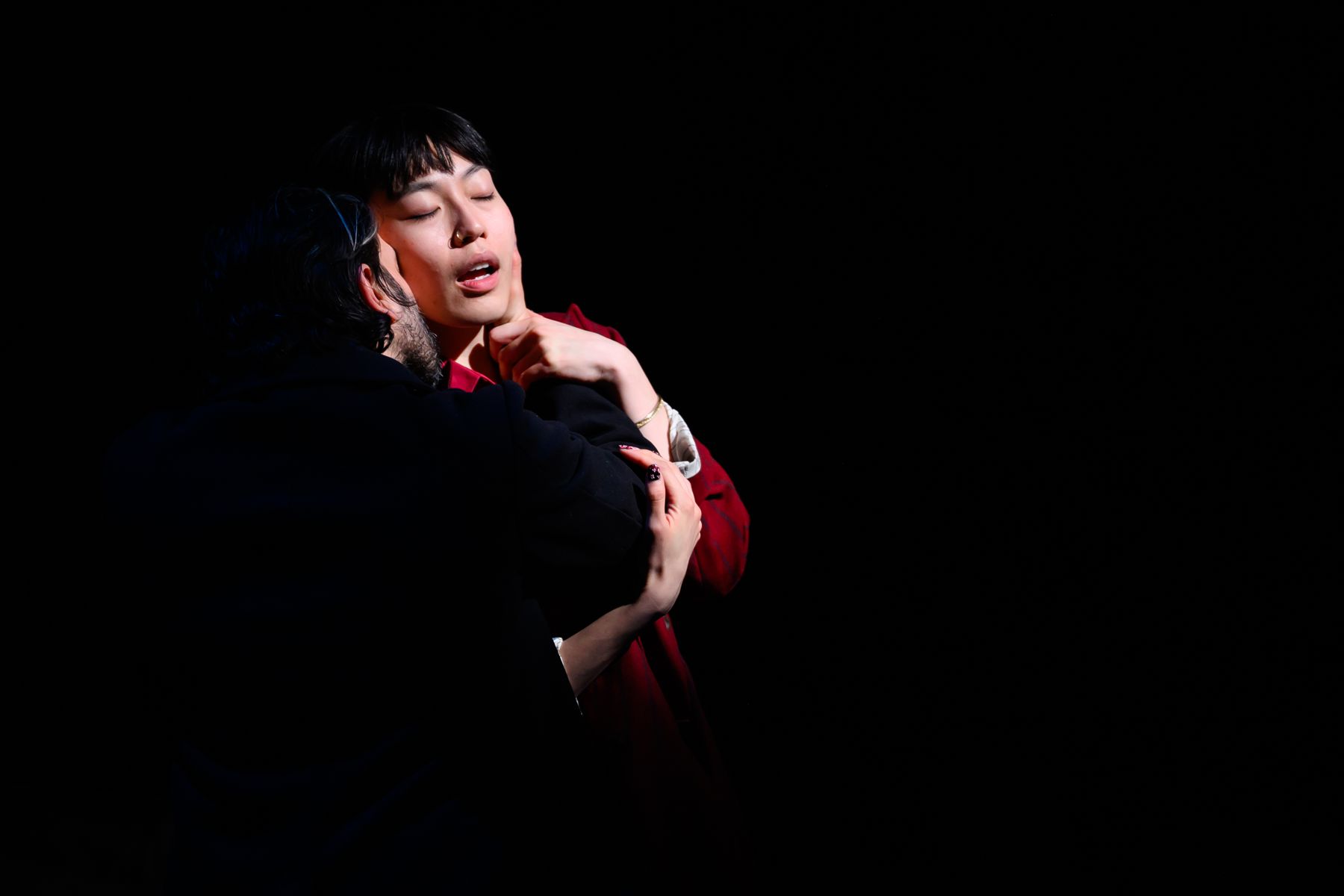 An embrace in near darkness